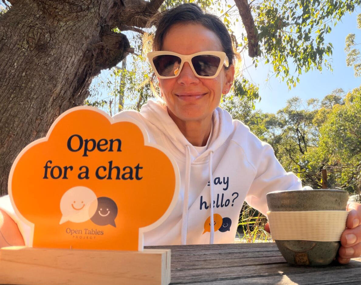 Open Tables Project Marker Founder drinking coffee with Open Tables Project marker